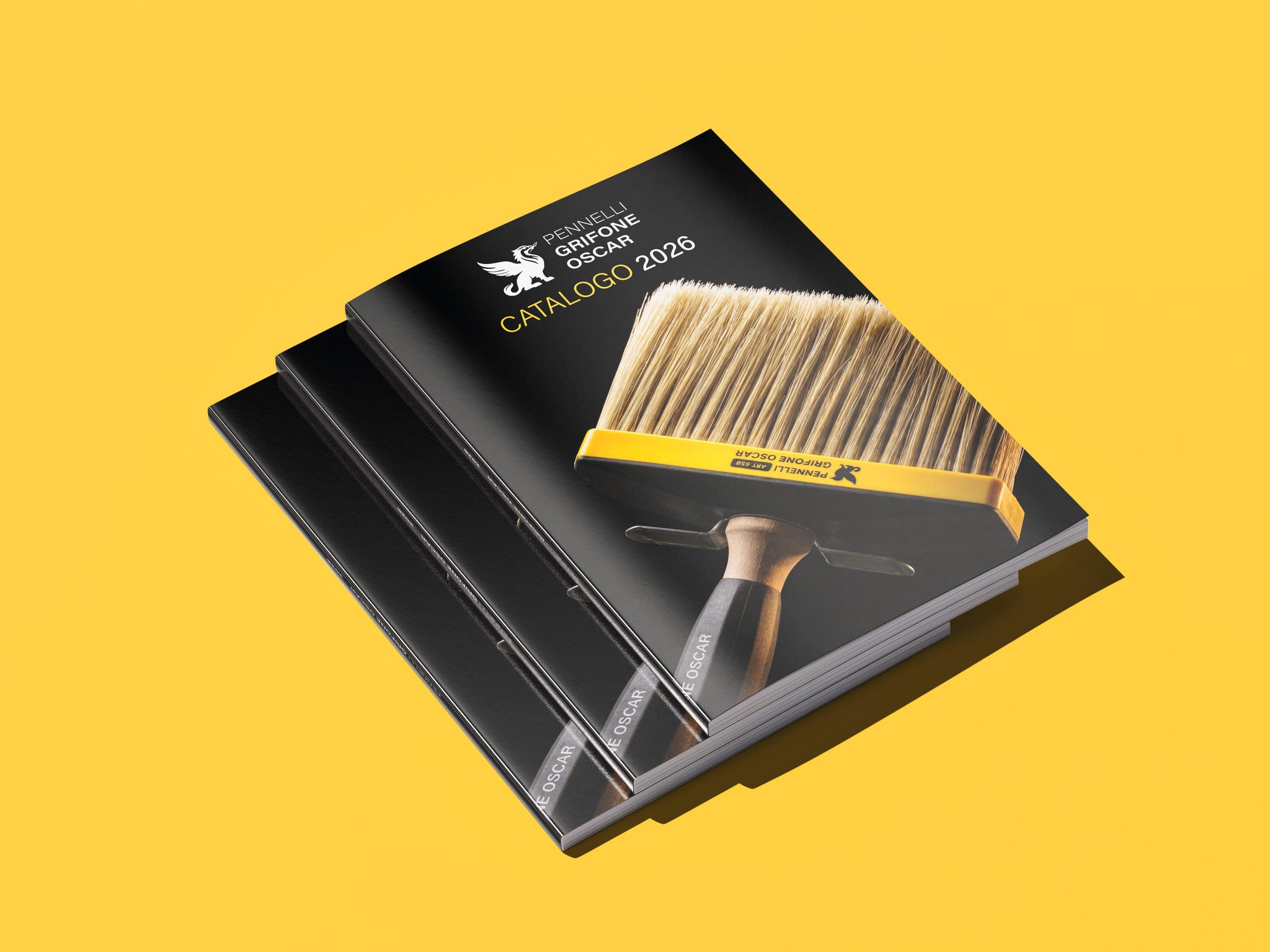 Tre copie del catalogo, una sull’altra, su un fondo giallo: in copertina il plafone 658 su fondo nero.